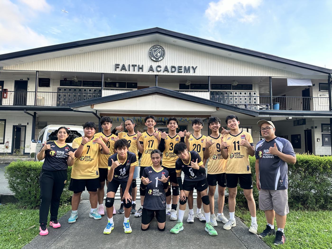 HDE boys and coaches in front of Faith Academy