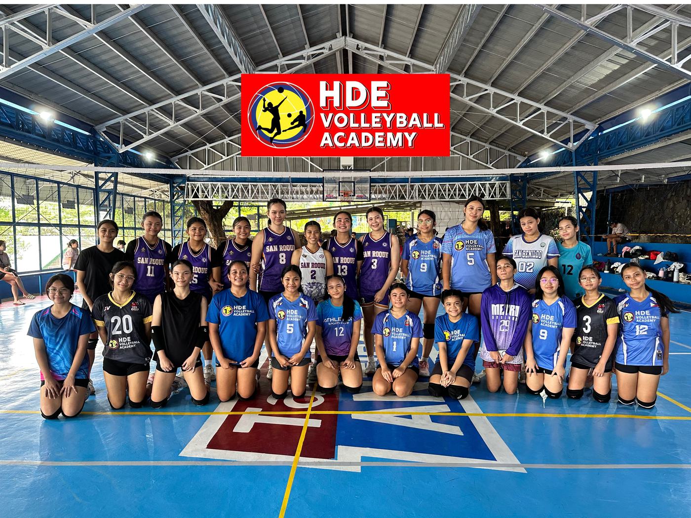 A weekend camp batch in purple, blue, and black under the HDE Volleyball Academy banner